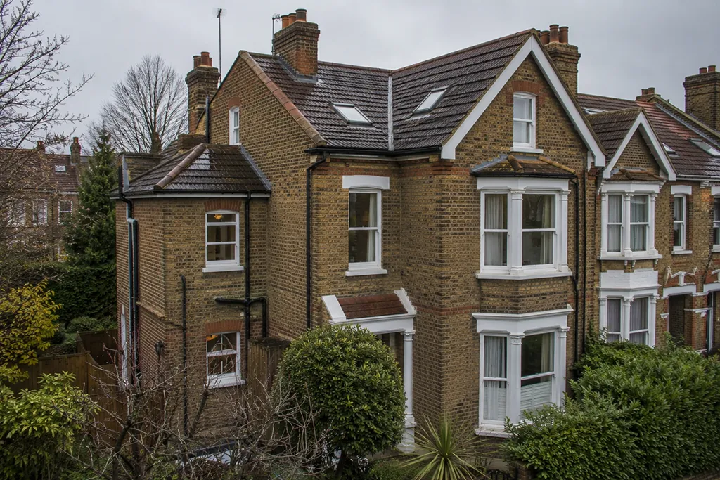 Residential house in London with pitched roof and roof details shown in context